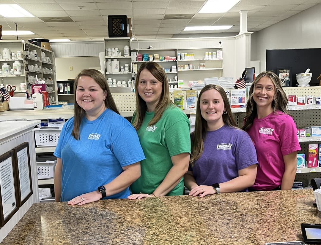 pharmacist greeting a patient inside Rosewood Pharmacy