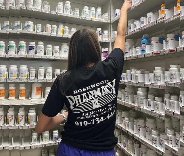 shelves stocked with popular health products at Rosewood Pharmacy