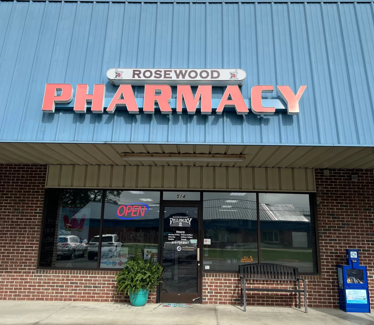 Rosewood Pharmacy team member assisting a patient